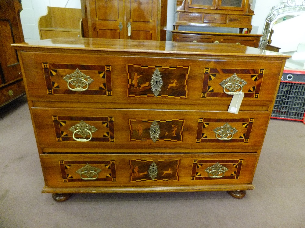 A mid 19th century oak wood chest of drawers inlaid with geometrical design of plum and maple wood
