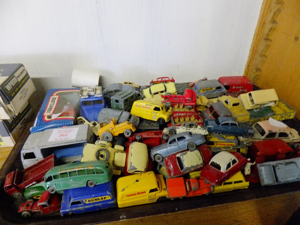 A large mixed selection of play worn Dinky toys