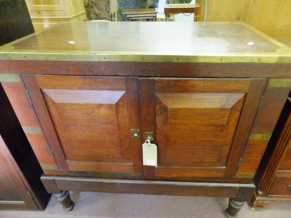 A 19thC Anglo Colonial brass-bound padouk wood campaign cabinet on stand, 85cm high x 91cm wide x