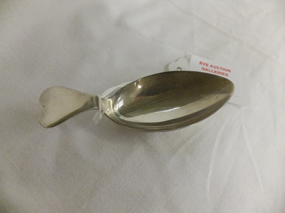 A Sheffield 1943 silver caddy spoon with heart shaped handle
