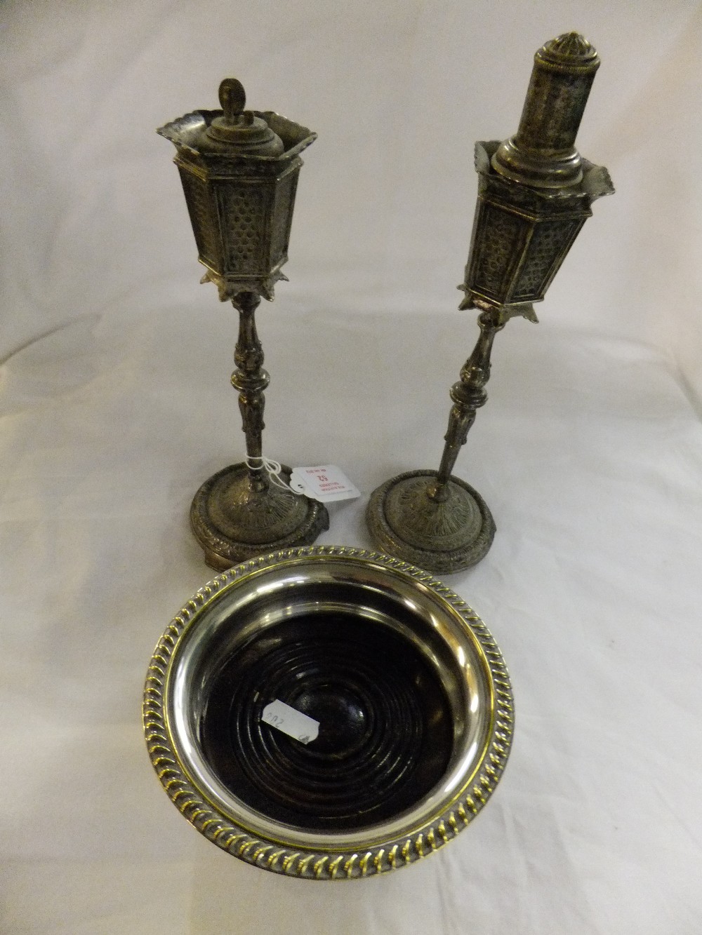 A pair of silver plated table lighters in the form of street lanterns and a silver plated wine