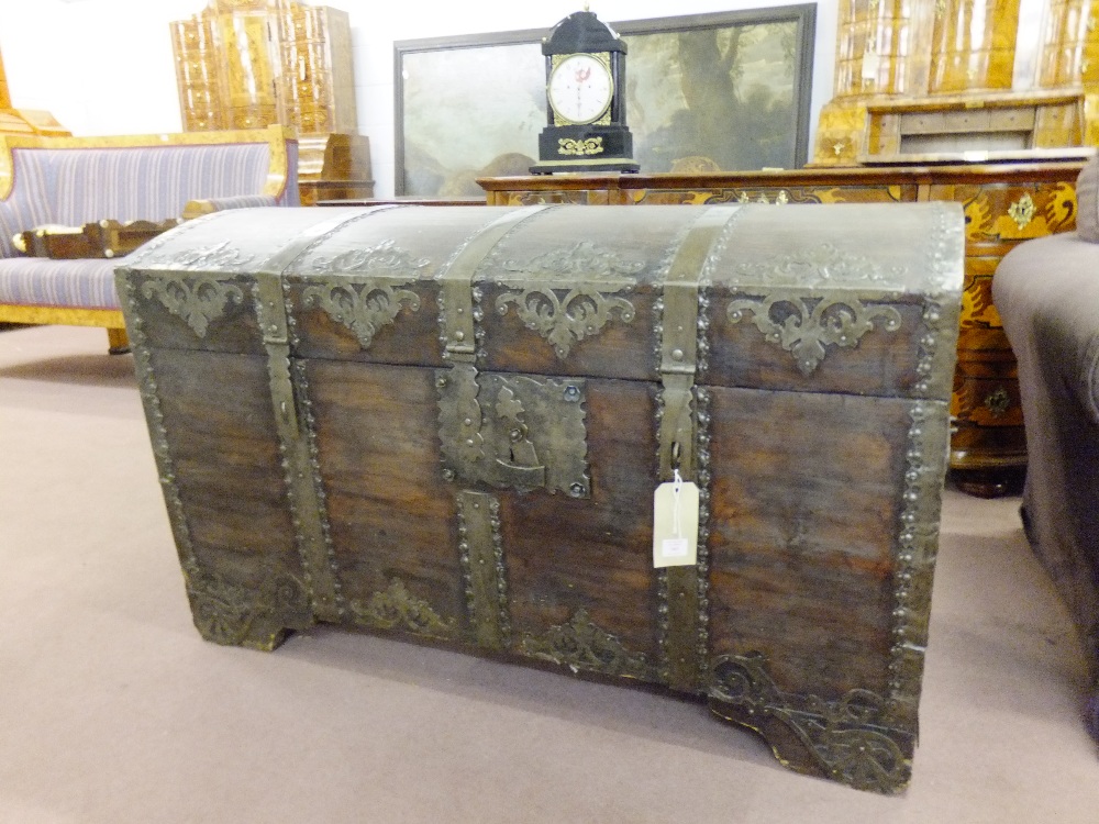 A late 18thC softwood carcass dome top chest with iron bands and mounts, having original lock and
