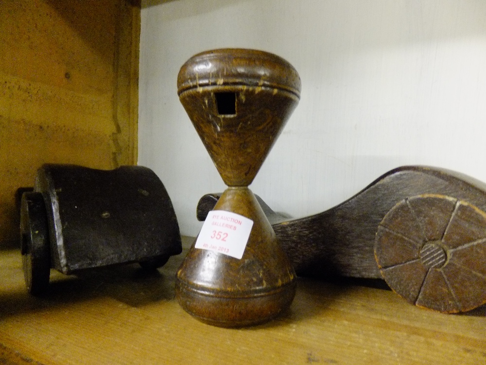 Two mahogany early model cannon bases on wheels, and an early child's whistling spinning toy