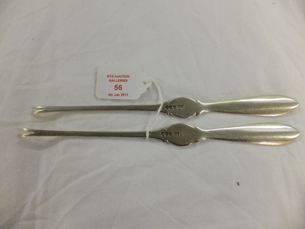 A pair of Sheffield Walker & Hall silver lobster picks