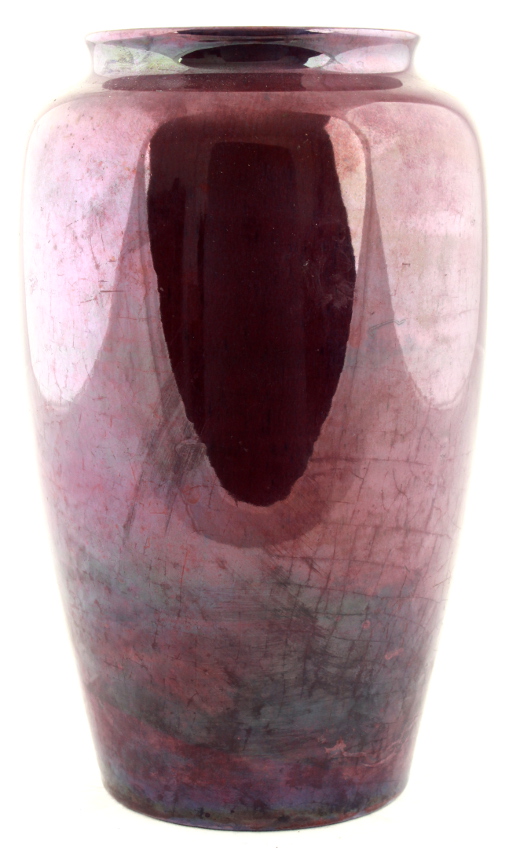 A Moorcroft purple lustre vase, 10.25ins. (26cms.) high (see illustration).