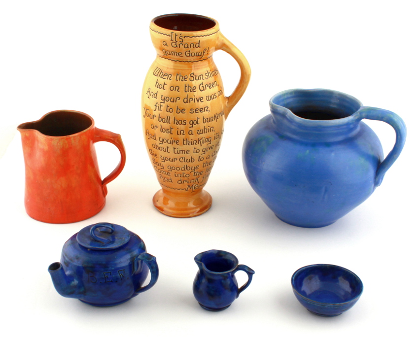 A group of six Brannam and Baron Barnstaple pottery items including a Baron blue glazed three-