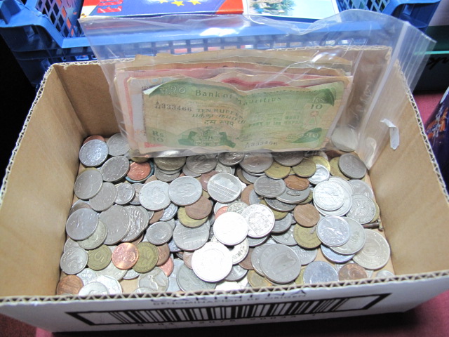 A Range of Foreign Coins and Banknotes, often current or redeemable.