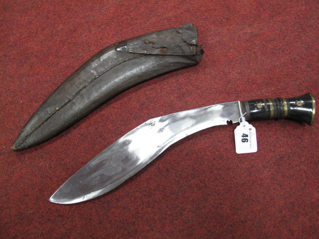 A Mid XX Century Kukri and Sheath, with bone and brass handle.