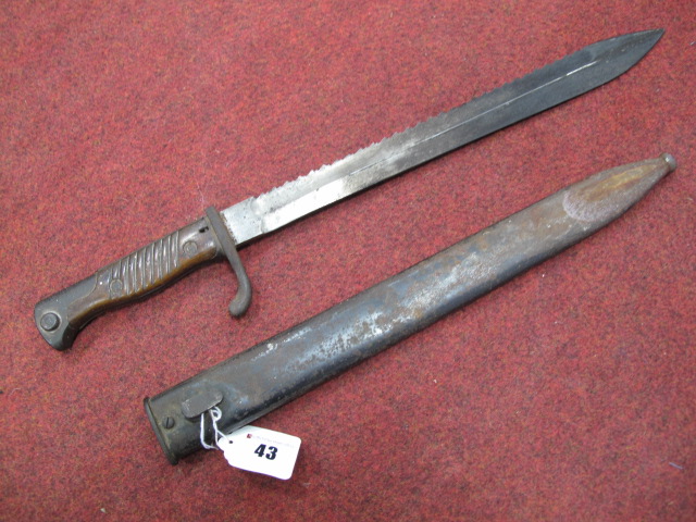 A WWI German Saw Back Pioneer Bayonet, overall blade length 36cms, blade stamped "Waffenfarrik