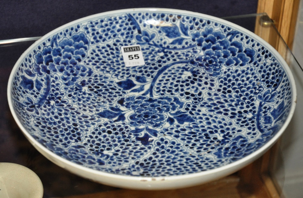 Late 19th Century Chinese blue and white saucer bowl decorated with allover flower pattern, 29cm