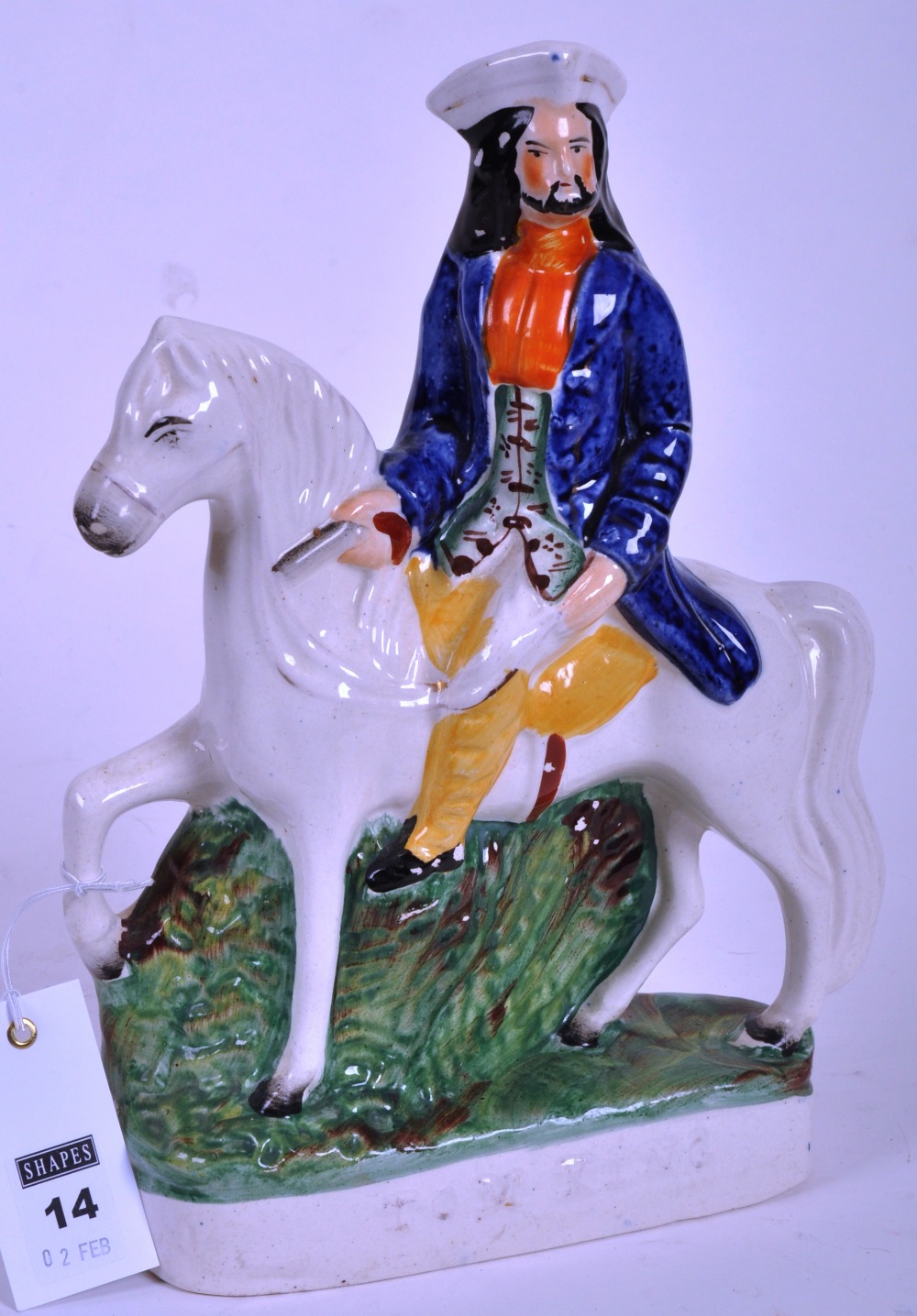 A Staffordshire flatback figure of Tom King on horseback, in polychrome coloured enamels, 28cm high