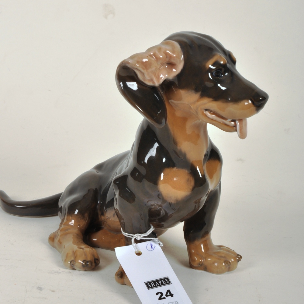 Royal Copenhagen figure of a Dachshund modelled seated, no.856, by Lauritz Jensen, 19 x 30cm