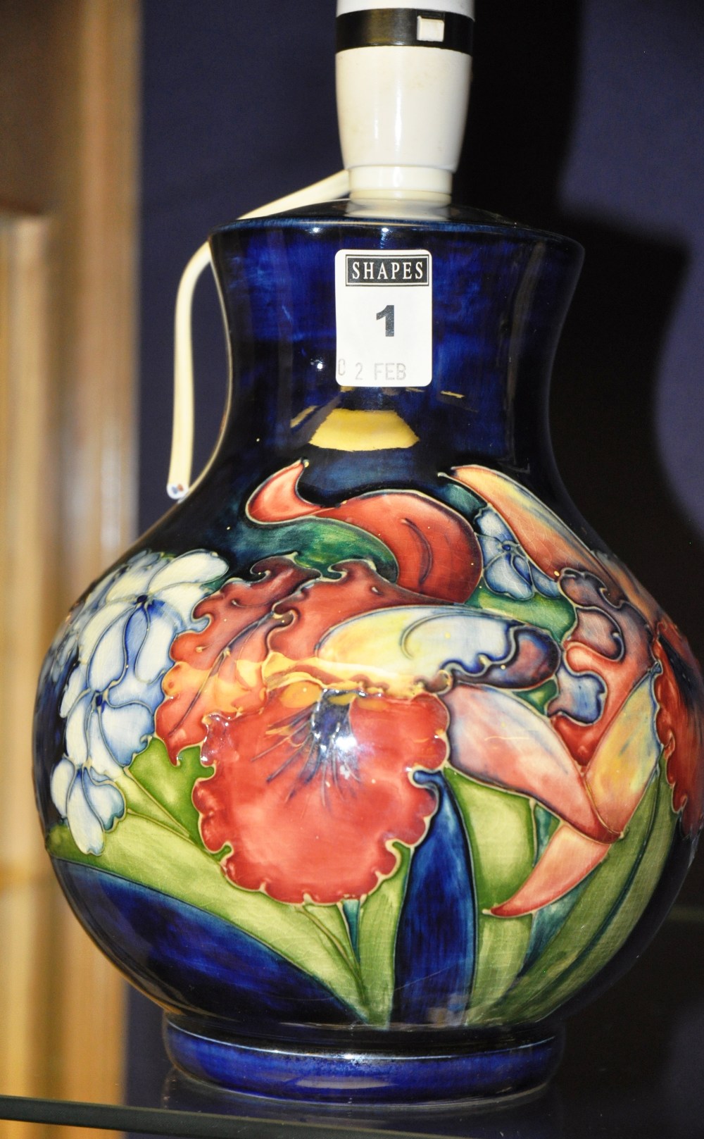 Moorcroft Pottery baluster lamp base, mid 20th century, the cobalt blue ground tube line decorated