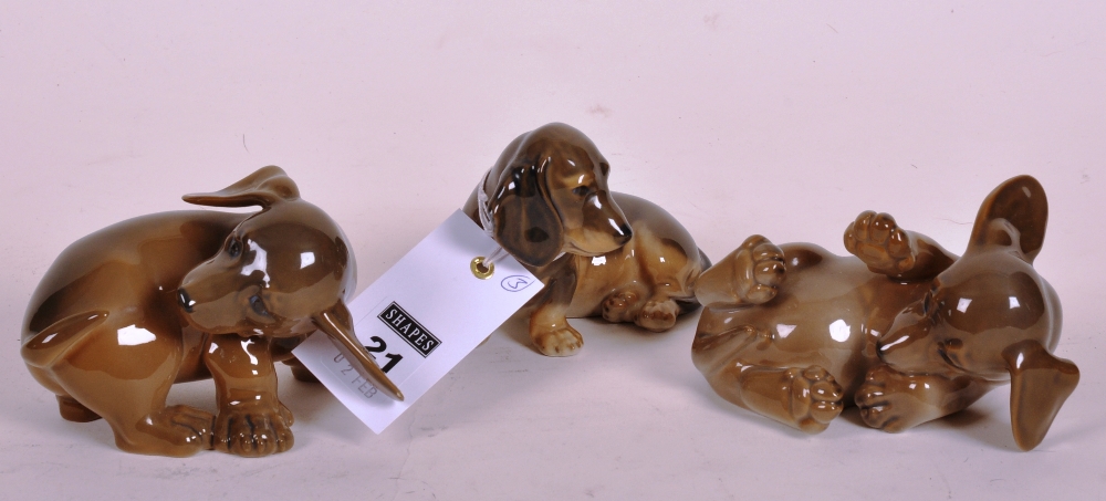 A group of three Royal Copenhagen Dachshund dogs, model no`s 1407, 1408 and 3140 (3)