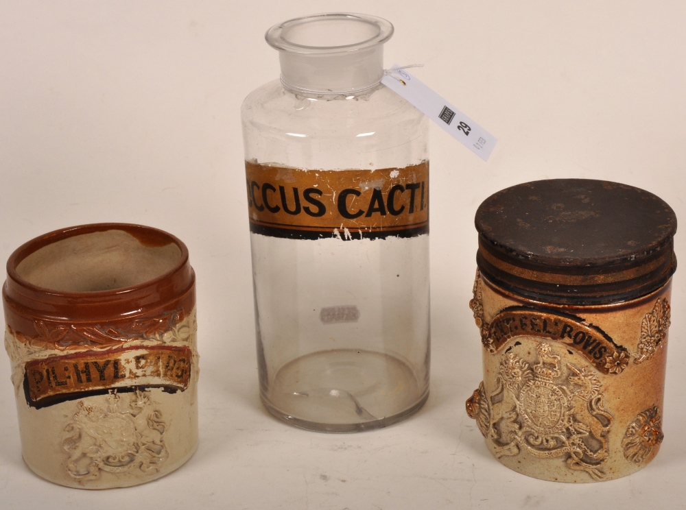 Two 19th century stoneware and salt glazed apothecary jars with applied crests and banners and a