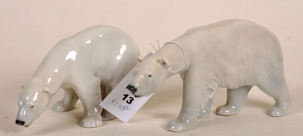 Two Royal Copenhagen walking polar bear figures, model no`s 320 and 321, designed by Carl Johann