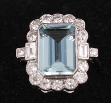 Art Deco style centre aqua marine of 3.5 ct. surrounded by .7 ct. of diamonds