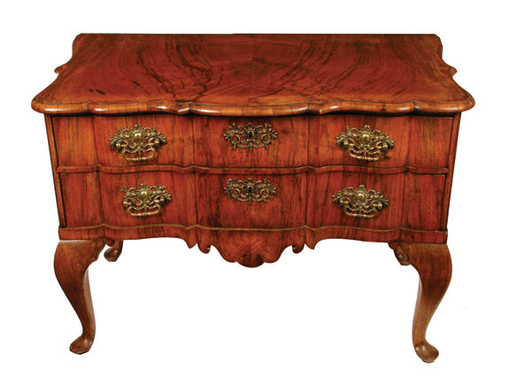 Eighteenth-century walnut chest of two drawers with serpentine sides and front, raised on cabriole