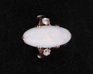 White gold opal ring with two diamonds either side