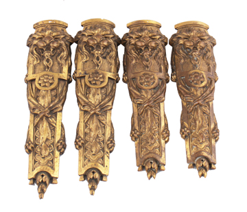 Set of four ormolu mounts with lion mask decoration, stamped Fournier 26 cm. long