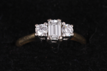 18 ct. gold and diamond ring with centre cushion cut diamond approx .5 carat and a smaller stone