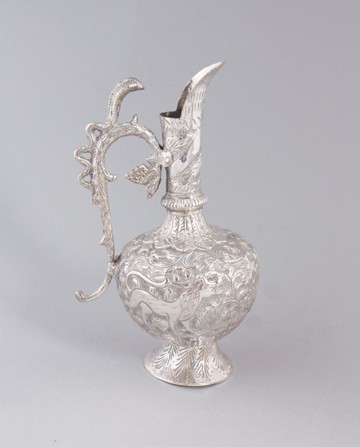 Nineteenth-century Anglo-Indian silver wine ewer with rich chased decoration depicting animals