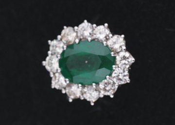 18 ct. white gold oval emerald 4.5 ct. surrounded by 1.2 ct. diamonds
