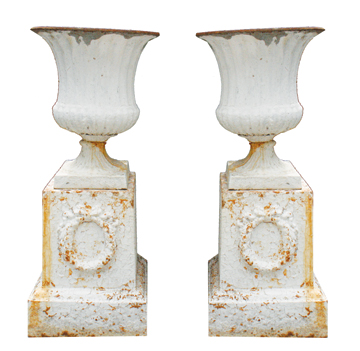 Set of four nineteenth-century cast iron garden urns, each on a stand