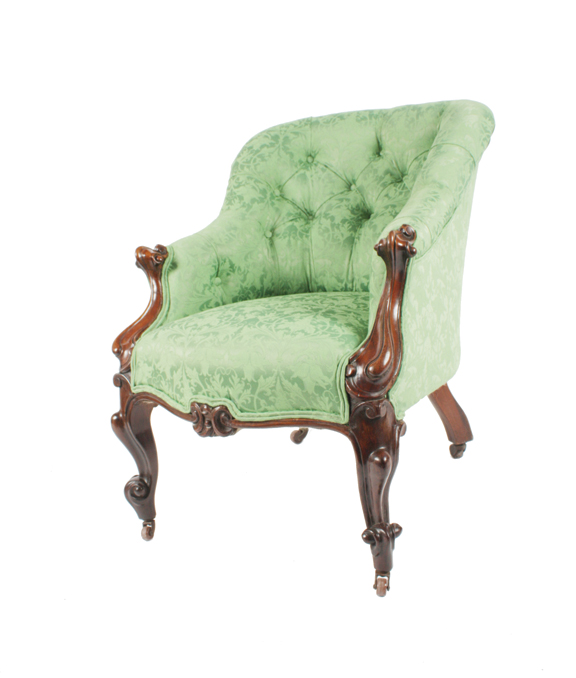 Early Victorian period mahogany and upholstered deep buttoned spoon back armchair, circa 1850