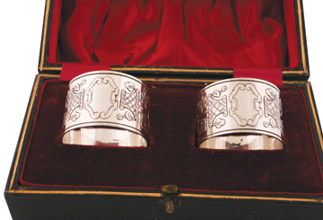 Pair of boxed sterling silver napkin rings, Sheffield 1892, Walker and Hall , 53 grams the pair