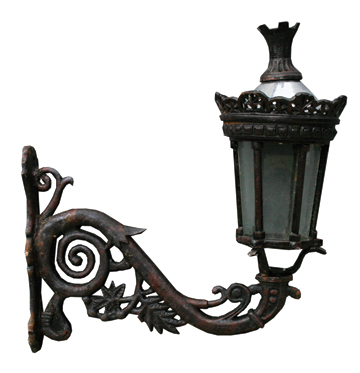 Pair of cast iron framed lamps and brackets 72 cm. high