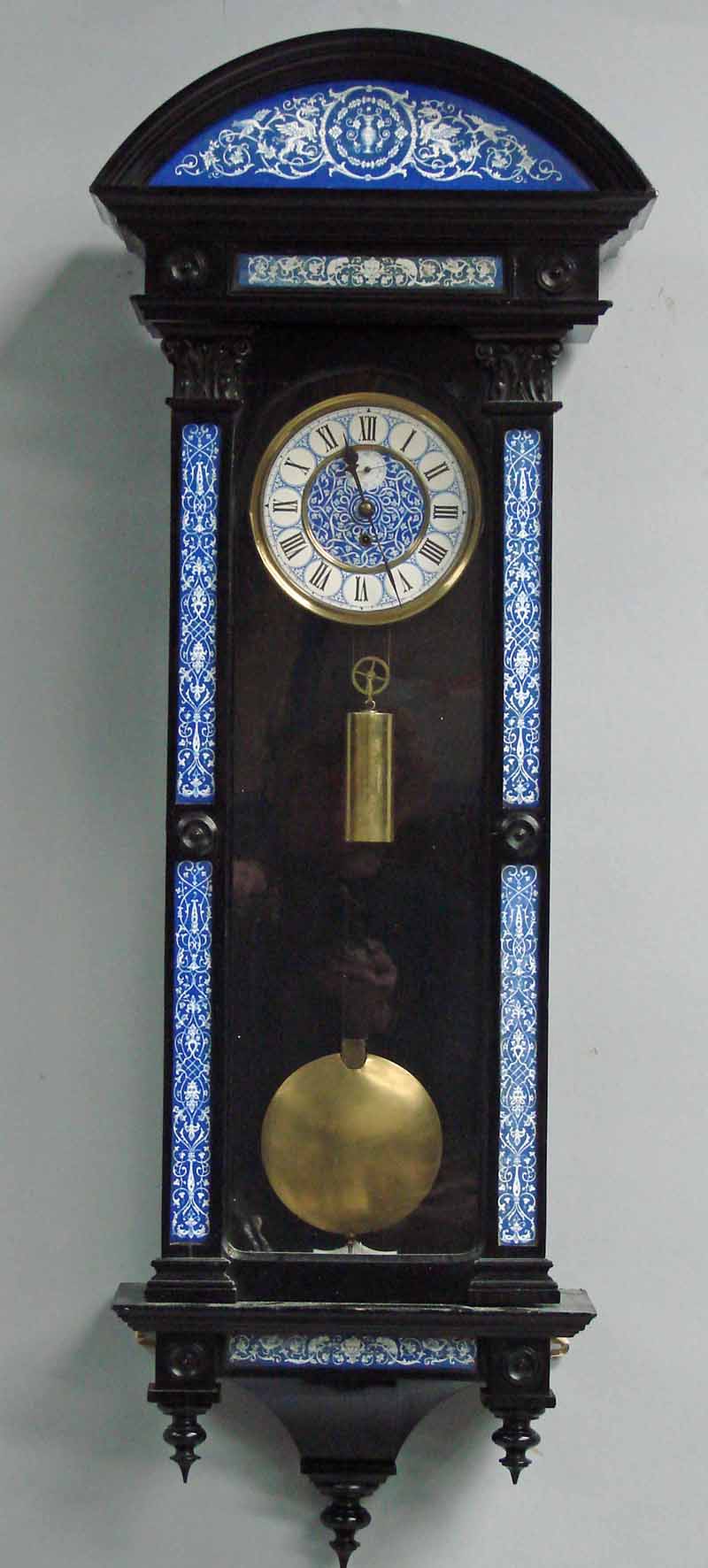 A Victorian ebonised wall clock, the single weight driven regulator movement with a white enamel two