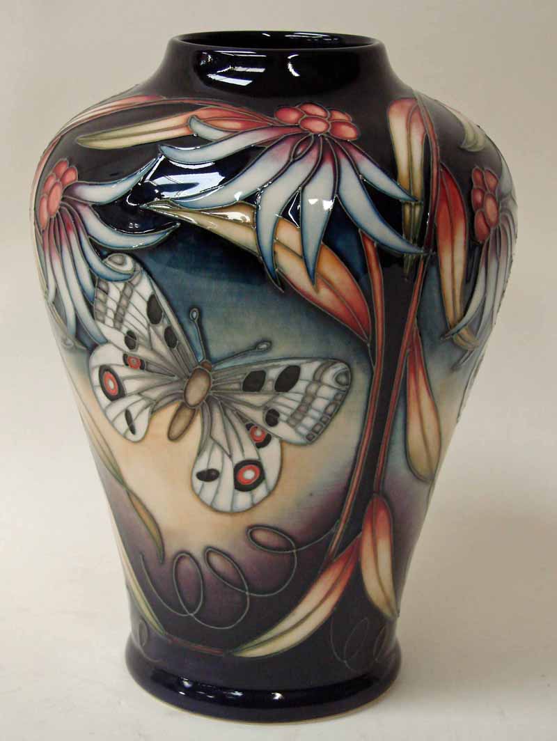 A Modern Moorcroft pottery baluster vase in the Apollo design by Sian Leeper, 22cm high with box