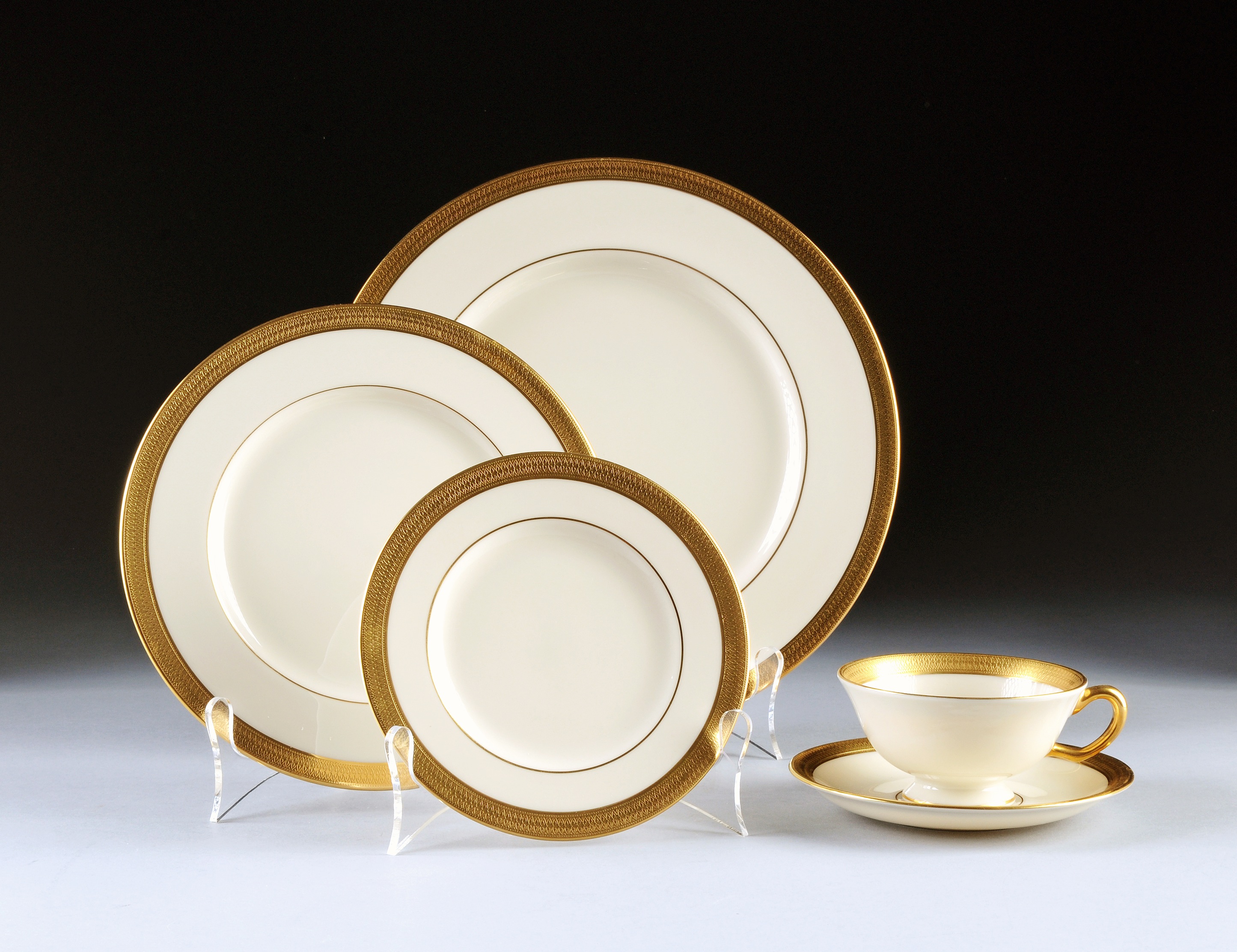 A FORTY-EIGHT PIECE LENOX PARCEL GILT IVORY GROUND DINNERWARE SERVICE, LOWELL PATTERN, in