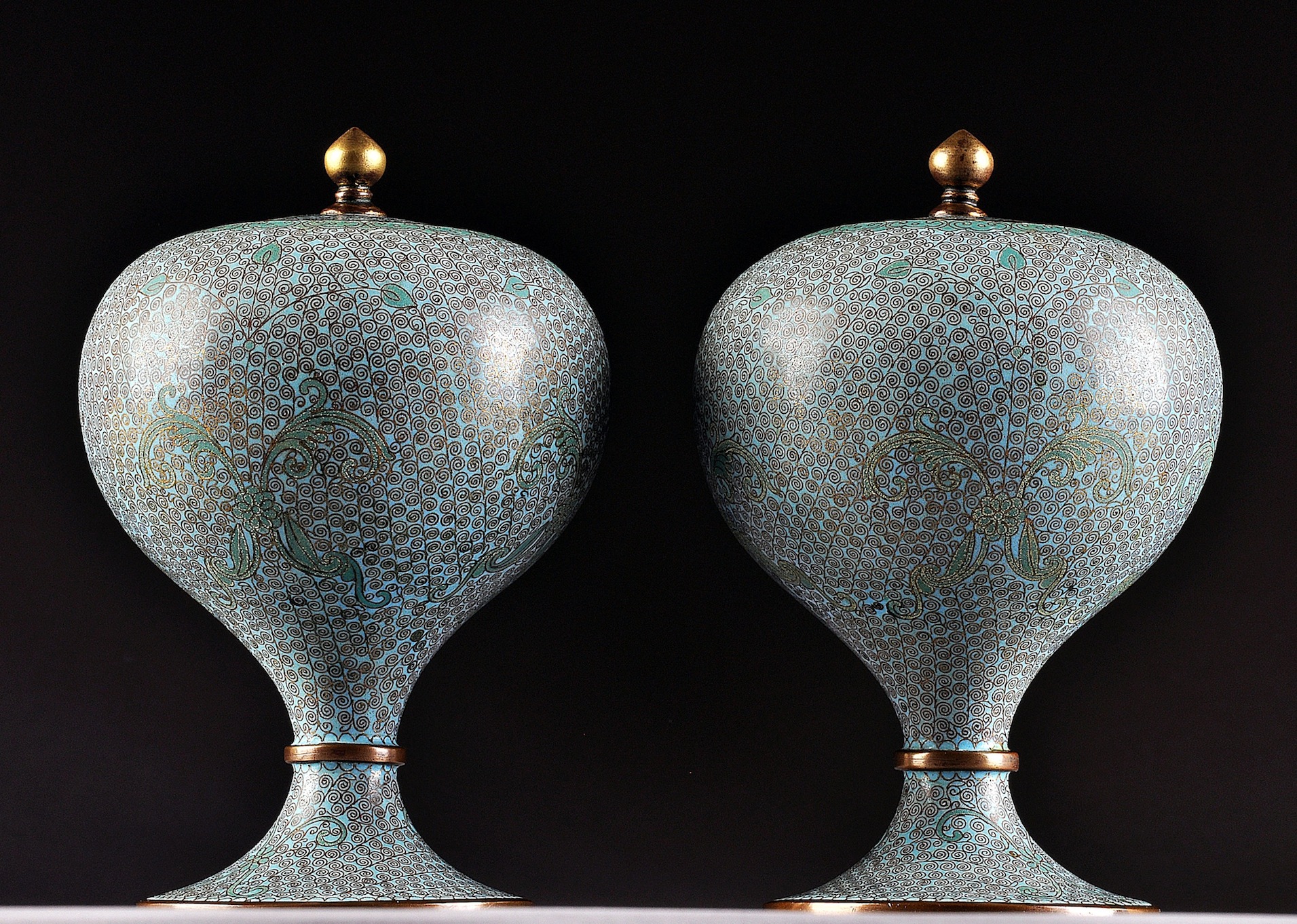 A PAIR OF CHINESE PALE BLUE GROUND CLOISONNÉ LIDDED URNS, POSSIBLY 19TH CENTURY, in the Persian