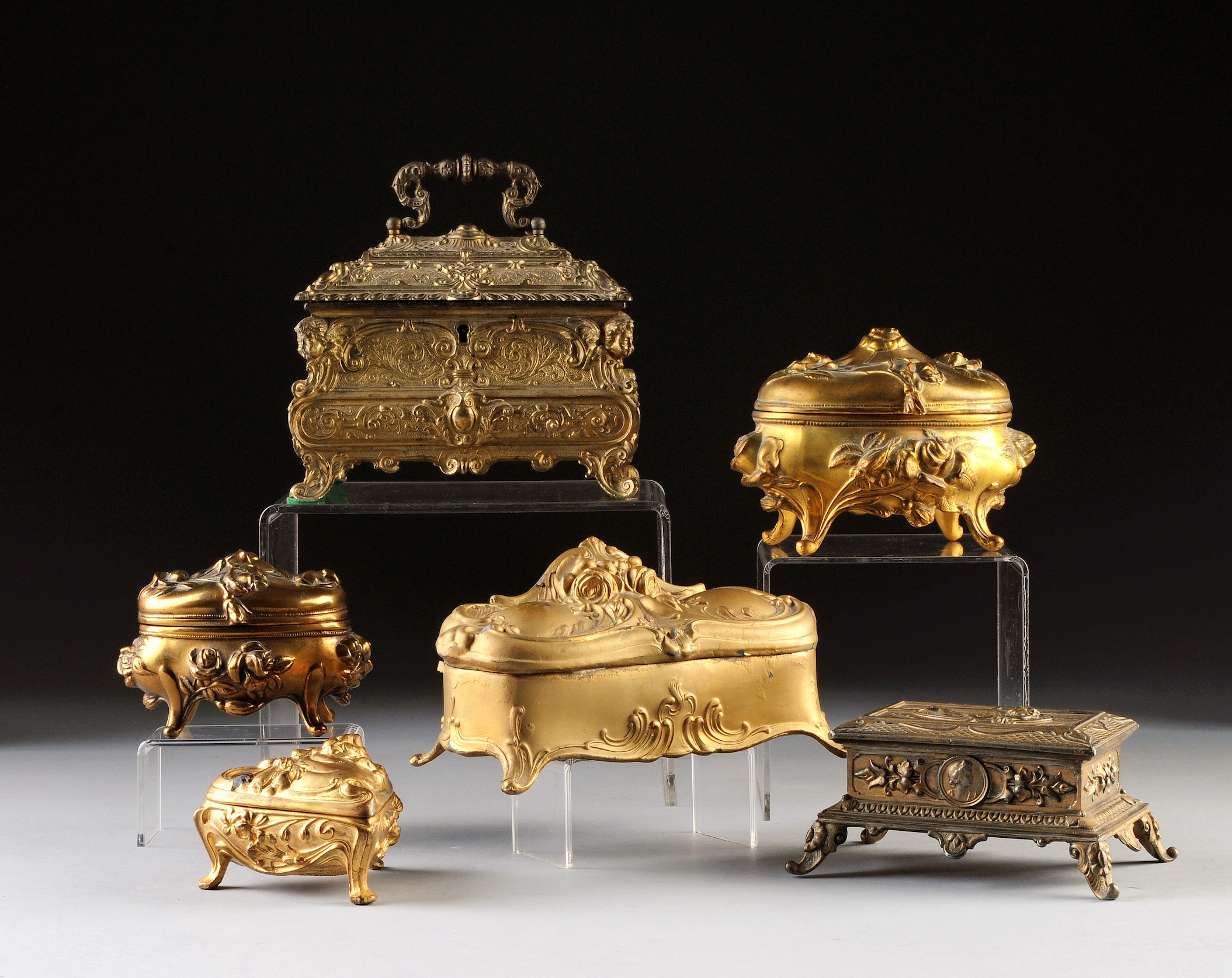 AN ASSEMBLED GROUP OF SIX ART NOUVEAU GILT METAL JEWELRY BOXES, POSSIBLY FRENCH, 1890-1918, one of