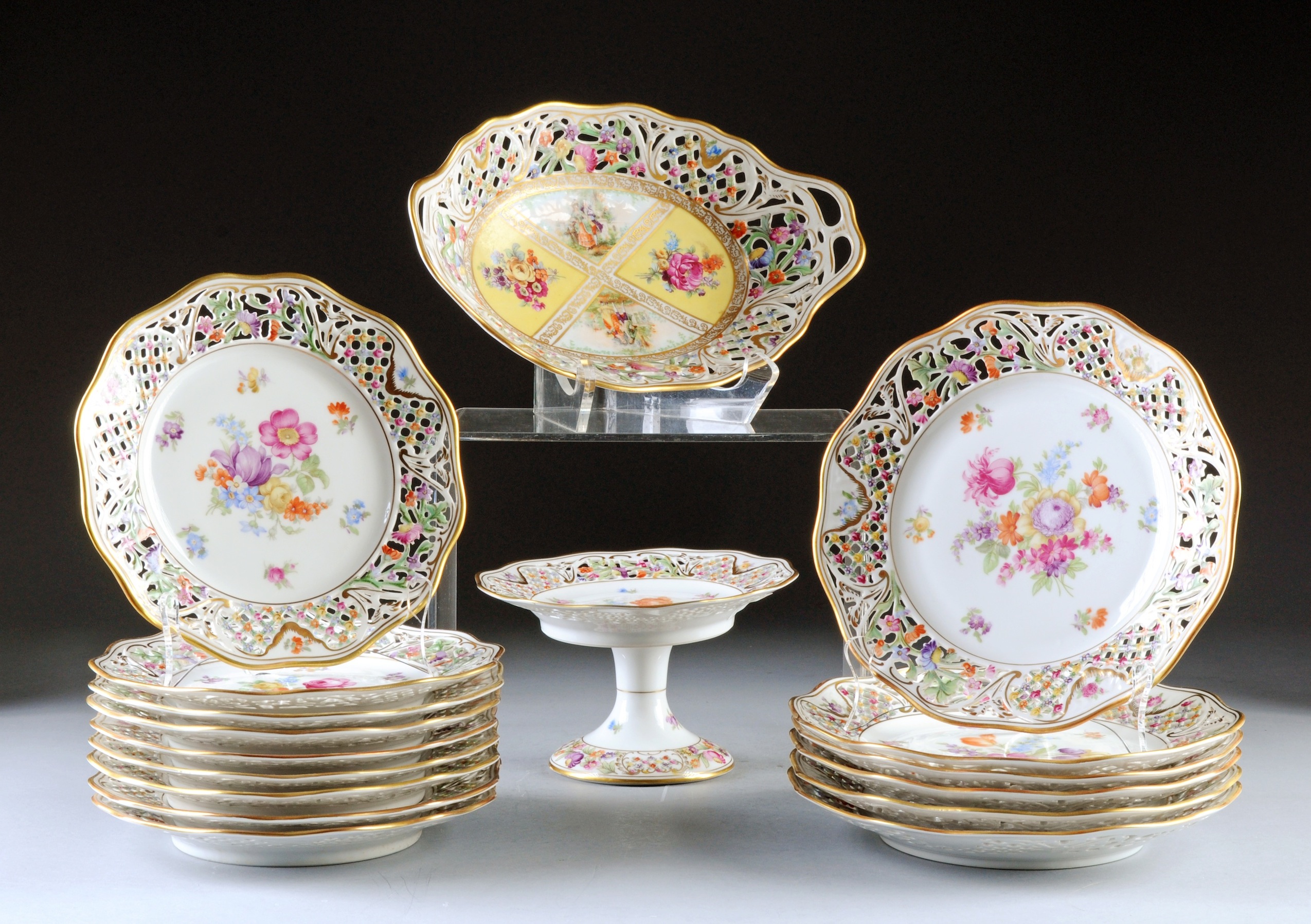 A SEVENTEEN PIECE SCHUMANN RETICULATED PORCELAIN PARTIAL LUNCHEON SERVICE, CHATEAU DRESDEN FLOWERS