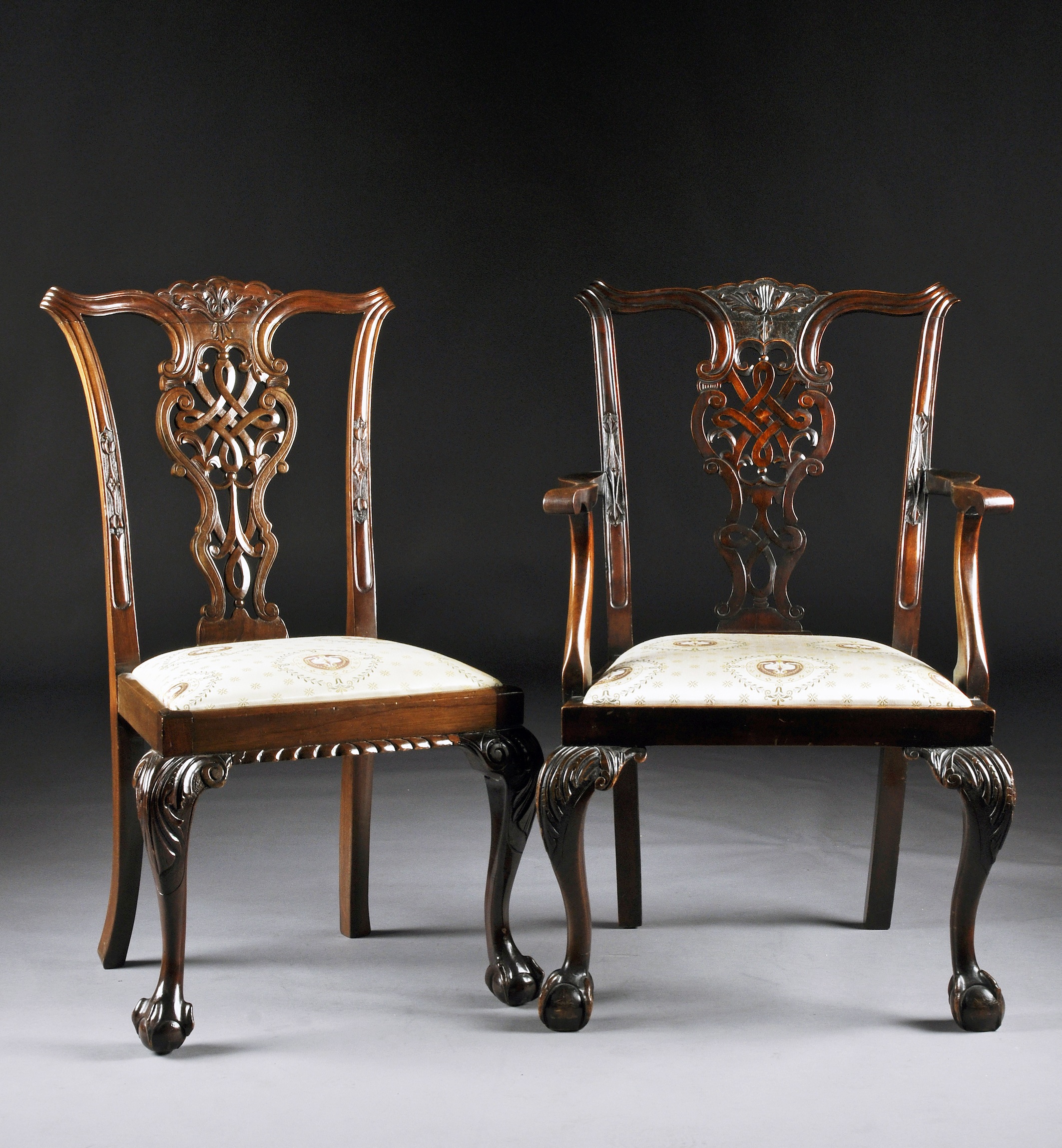 A SET OF EIGHT CHIPPENDALE STYLE CARVED MAHOGANY DINING CHAIRS, 19TH CENTURY, each with a