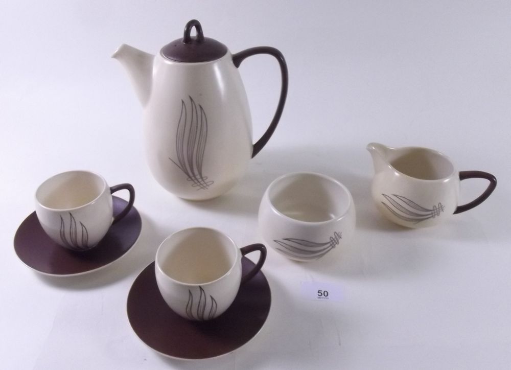 A Carlton Ware brown and cream coffee set comprising coffee pot, six cups and six saucers