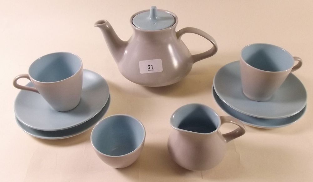 A Poole turquoise and grey tea for two set comprising: two cups and saucers, milk, sugar, two tea