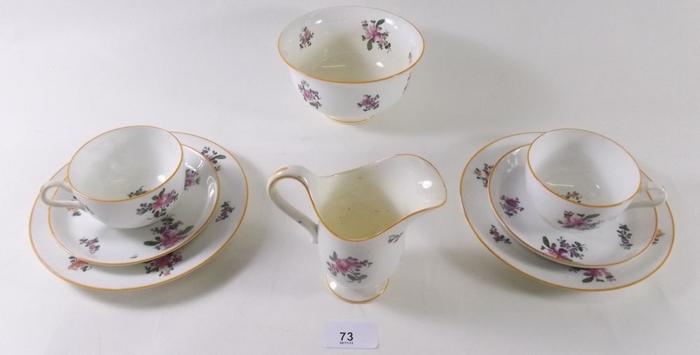 A Victorian white teaset painted floral spray decoration comprising:- eleven cups and saucers,