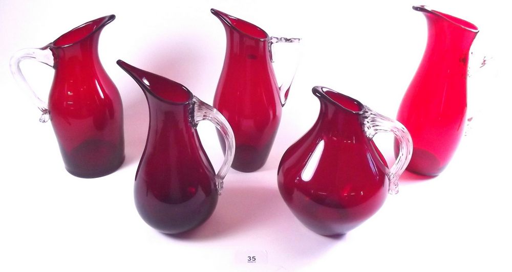 Six Whitefriars ruby jugs with clear handles