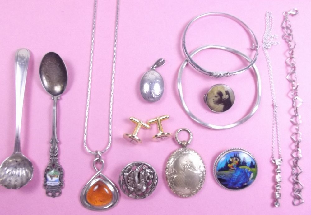 A selection of jewellery, spoons etc