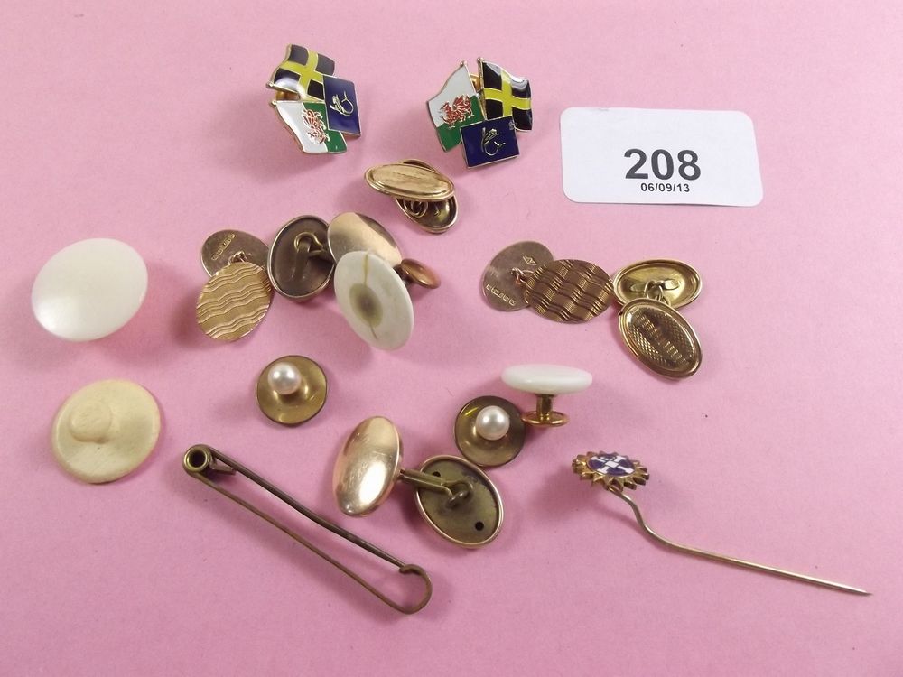 A pair of 9 carat gold cufflinks, two other pairs of cufflinks and two studs