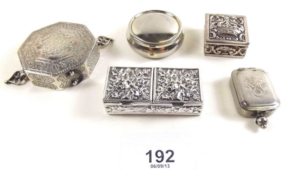 A group of five silver plated and white metal pill boxes