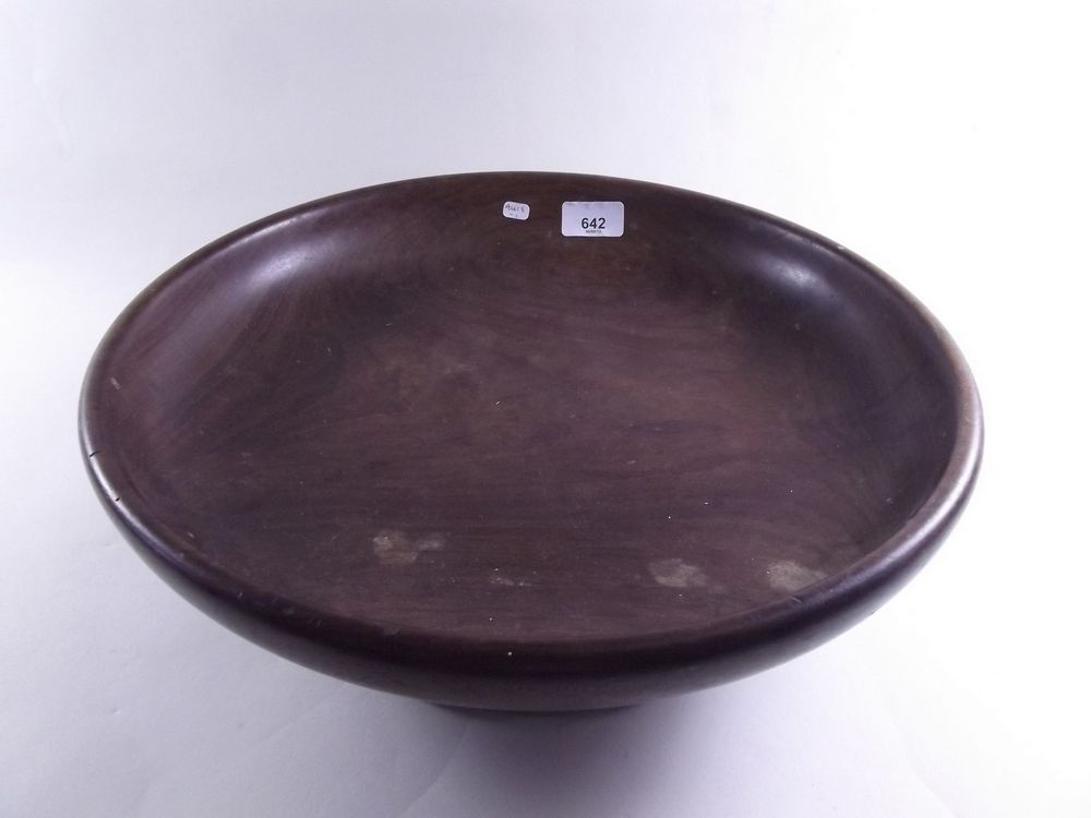 A large turned wooden fruit bowl