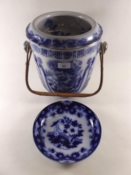 A Victorian flow blue toiletry pail and similar saucer