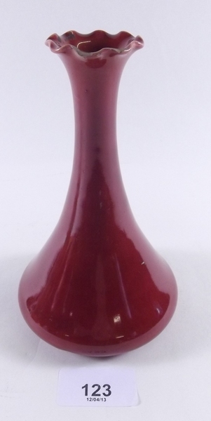 A Burmantofts frilled top red vase, slight wear to rim