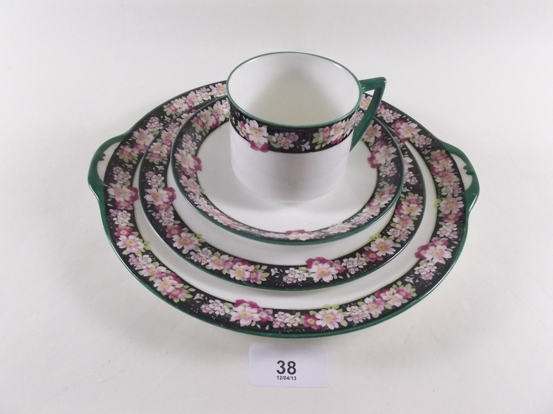 A Royal Doulton floral trio and cake plate