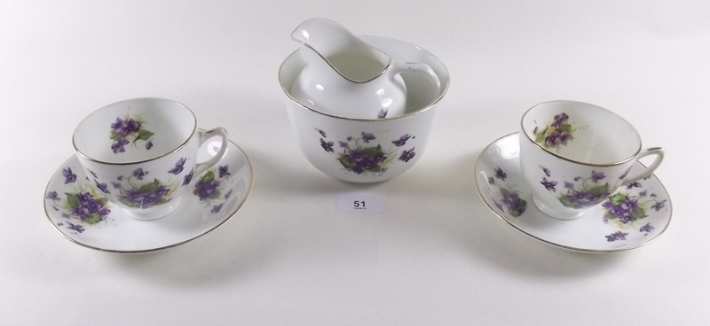 An Edwardian teaset printed violets comprising 6 cups and saucers, 6 tea plates, jug, sugar and 2